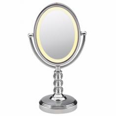 Get a close-up view of your beauty routine with this two-sided Adjustable Cosmetic Mirror from Conair. The 7x magnification and lighted frame allow you to focus on details, while the 1x magnification lets you see the whole picture. With high-polished chrome finish and faceted crystal accented stand, this pretty oval mirror will make a nice addition to your powder room. Just wipe clean with a damp cloth to maintain its shine. Color: Silver.