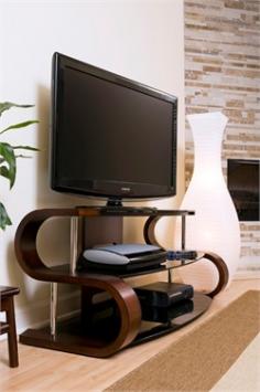 The Metro Series TV Stand 120 features a curved dark wood veneer and modern opaque black tempered glass shelving. A solid piece of beautiful furniture. Assembly required. The 120 TV Stand holds up to a 60? TV with a weight capacity of 155 lbs. Form and function are combined wonderfully in this TV stand! Product name: Metro Series TV Stand 120 finish: Walnut type: TV Stands overall dimensions: 22" L x 52" W x 22" H max tv size: 60" material: Wood & Glass assembly required: TRUE weight: 98 lbs.