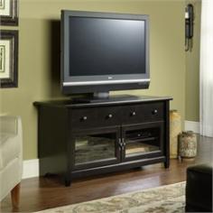Sit back and enjoy your favorite show thanks to this Sauder TV stand. In estate black finish. Product Features: Holds TVs up to 95 lbs. and up to 44-in. wide. Modern design makes a great addition to contemporary decor. Product Details: 24H x 44 1/4W x 15 1/4D Frame: engineered wood Doors: glass Some assembly required Manufacturer's 5-year limited warranty Model no. 409047 Promotional offers available online at Kohls.com may vary from those offered in Kohl's stores. Color: Black. Gender: Unisex. Age Group: Adult. Material: Glass/Wood.