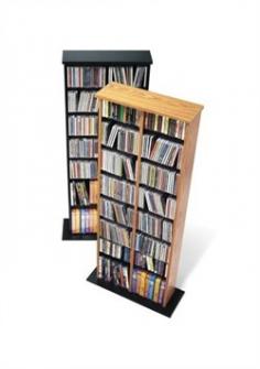 Adjustable shelves holds variety of media sizes. Capacity: 320 CDs, 130 DVDs, 240 Blu-Ray discs and 80 VHS cassettes. Enlarged bases for extra stability. Warranty: Five years. Made from CARB-compliant, laminated composite woods with sturdy MDF backer. Made in North America. Minimal assembly required. 22 in. W x 8.75 in. D x 51 in. H Attractive and versatile, the Double Multimedia Storage Tower is a practical storage solution for your media collection. Its shelves, separated by a central divider, boast room for over 300 CDs. Each shelf is fully adjustable, meaning you're free to customize according to your collection's needs. Fill and sort through your collection with ease, thanks to the horizontal storage. Attractive and functional, this tower is perfect for the casual collector.