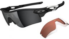 The original Oakley Radar was a sports optics game-changer when it landed in the pro peloton in 2007. It was exceptionally lightweight, offered an excellent fit under a wide variety of cycling helmets, and the carefully sculpted design was simultaneously aggressive and universally wearable. The Radar did a lot of things right, but taking advantage of the frame's lens interchangeability was, more often than not, tedious at best, and required a flowchart at worst. It was almost easier to simply own multiple pairs for different applications than to try changing the lenses. To put an end to this frustration, Oakley introduced the Radarlock Path - a subtly redesigned Radar, quite possibly the quintessential sporting sunglass. Lay the two next to each other, and you'll notice that the geometry, frame profiles, and signature earstem exhaust ports of the original Radar and the new Radarlock are more or less the same. But that's about where the similarities end. The Radarlock is constructed from the same lightweight O-Matter polycarbonate, but the earstems are now constructed from several different pieces, giving them a more dramatically sculpted design that grants a slightly greater degree of outward flex. The O-Matter hinges are now tensioned, giving them a slight spring when opening or closing. Oakley also opted to terminate the Unobtanium rubber earsocks a bit further from the stem tips to give the glasses a better fit with many helmet retention systems, and also to leave room for perforations that allow fitment of a retention strap (sold separately). As evidenced by its name, the Radarlock is characterized by Oakley's Switchlock technology, which allows you to change out the lens quickly and efficiently. Due to the Radar's unique Polaric Ellipsoid shield lens geometry, the mechanism is a little different than what you'd find on the Jawbone or Fast Jacket, but very simple nonetheless. Simply engage the slider switch on the inside of the left temple, and pivot the ear.