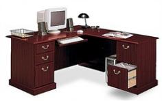 If you want to make a sweeping statement without saying a word, the Bush Saratoga Executive Desk is the solution of choice. This luxury desk features filing drawers that accept letter, legal or A4-size files. L-shaped form with double pedestal base File drawers Enclosed storage Durable melamine surfaces resist scratches, abrasions and stains Entire unit can be assembled either right or left handed Box drawer for office supplies Wide retracting keyboard shelf Dimensions: Desk depth: 29.33" Return depth: 23.35" Keyboard Shelf Compartment: 23.602" W x 2.736" H x 11.535" D Box Drawer Compartment: 12.205" W x 3.358" H x 15.787" D File Drawer Compartment: 12.205" W x 8.968" H x 18.307" D Overall: 66.023" W x 30.472" H x 71.220" D The writing surface dimensions are approximately 64" W x 27" D for the desk and 40" W x 20" D for the return.