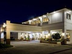 Located in Laoag City, Ilocos Norte, this comfortable and charming hotel with its Spanish-colonial style offers comfort for leisure and business travellers alike. It is a few minutes from the beach and a fifteen-minute drive from the famous Paoay Church. Guests can relax in the sun by the premises' outdoor swimming pool, and can enjoy delicious meals including breakfast in the on-site restaurant. The premises also boast function rooms and a convention centre which are perfect for family events such as weddings, and the business centre can accommodate up to six business events at one time. The 100 comfortable guest rooms provide contemporary accommodation with views over the pool or city. The accommodation comprises dormitories with bunk beds, deluxe rooms, and suites, all with hot showers, cable TV and personally controlled air-conditioning.