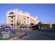 your home away from home when you're on the road. welcome to the Hampton Inn & Suites Lathrop Conveniently located in the heart of California's central valley just off I-5, our Hampton Inn & Suites in Lathrop hotel offers weary travelers a comfortable place to rest. Whether you're driving to Yosemite National Park, Black Oak Casino, Disneyland Resort, Reno, Lake Tahoe or San Diego, our Lathrop hotel is the perfect place to recharge your batteries. Located near Stockton, Tracy, Manteca, and Modesto, our Lathrop hotel is near many local area attractions such as Bass Pro Shops- Outdoor World, Gallo Center for Arts, and the Stockton Arena. If traveling on business, the Hampton Inn & Suites hotel in Lathrop, CA is located an hour drive from the San Francisco International Airport, the Sacramento International Airport, and the Oakland International Airport and 10 miles from the Stockton Metropolitan Airport. We are walking distance to Lathrop's Business Park, and two miles from the Crossroads Industrial Park, and centrally located near the home of many of Lathrop's largest businesses. The hotel is also host to many tournament families and is centrally located nearby several baseball, soccer, and sports complexes like Big League Dreams, Tracy Sports Complex, Woodward Park, and Mistlin Sports Complex The Hampton Inn & Suites Lathrop hotel is located near The River Mill which hosts some of our area's most gorgeous weddings and events. So book your room today and discover why our friendly Lathrop hotel is your home away from home when you're on the road. Whatever the reason for your travels to the Central Valley, we are here to help make it Hampton for you services & amenitie Even if you're in Lathrop to enjoy the great outdoors, we want you to enjoy our great indoors as well. That's why we offer a full range of services and amenities at our hotel to make your stay with us exceptional Are you planning a meeting? Wedding? Family reunion? Little League game? Let us help you with our easy booking and rooming list management tools * Meetings & Event * Local restaurant guide
