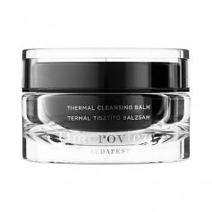 With multiple awards the Omorovicza Thermal Cleansing Balm works to purify your skin. The powerful yet gentle formula will effectively remove all traces of make-up including waterproof mascara whilst caring for the skin and ensuring that essential ingredients are not lost. Your skin will be left soft smooth and supple thanks to the delicate mix of natural hydrating ingredients. The black balm features Hungarian Moor mud which works to detoxify your skin by drawing out any impurities that are clogging up your pores whilst almond oil replenishes the moisture levels in your skin. Enriched with a high concentration of minerals such as calcium zinc copper and magnesium the cleansing balm helps to improve the production of collagen to strengthen the skin barrier and to fight against free radicals. Infused with the Pannon Complex unique to Omorovicza the cleansing balm will help your skin absorb the skin-friendly ingredients therefore enhancing your complexion's overall appearance. Appropriate for all skin types. A.B. Directions for use: Apply to your fingers and rub together. Massage into the skin. Wipe away using a cleansing mitt or cloth.