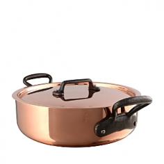 This 5-qt. Sauteuse with Cast Iron Handles is excellent for browning or braising cuts of chicken, beef, or pork, or when sauteing vegetables under high heat. The pan's straight sides also make it great for multi-stage pastas and casseroles that require sustained stirring and simmering. The tight-fitting lid seals in heat, moisture, and aromas on to give sauces a complex, rich flavor and meats a tender juiciness. The Cuprinox cookware line features an extra-thick 2.5mm copper exterior and includes a thin layer of stainless steel on the interior of the line's pots and pans. The stainless interior resists sticking, doesn't react with acidic foods, and cleans easily with a sponge. The cookware also offers durable handles anchored with rivets that hold up to heavy use. Mauviel, a French family business established in 1830 and located in the Normandy town of Villedieu-les-Poeles, is the foremost manufacturer of professional copper cookware in the world today. Highly regarded in the professional world, with over 170 years of experience, Mauviel offers several different lines of copper cookware to professional chefs and home cooks that appreciate the benefits of their high quality products.