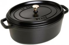 Dutch Ovens - The 7-Qt. Staub Wide Oval Cocotte features elegant enameled cast-iron and a self-basting system for restaurant-quality, gourmet entrees and one-pot dishes. Handcrafted in France, the Staub cast-iron cocotte prepares roast beef, pork, poultry, vegetables and more to succulent, flavorful perfection. With its superb heat distribution and retention, the Staub Dutch oven hides its secret under the lid. Rounded spikes collect and release condensation to shower juices continuously over food. The circulation of heat with juices allows ingredient flavors to maintain full intensity, while preserving nutrients. A Staub signature black matte enamel interior is superior for high-heat searing, plus braising and caramelizing. The more you cook with the oval cocotte, the better it performs, seasoning naturally with use, without maintenance. Cast in a single-use mold, the cast-iron cocotte is high-fired at 1,400 F, with 2-3 separate coats of enamel inside and out and is PTFE- and PFOA-free. Resistant to - Specifications Made in France Material: enameled cast-iron, stainless-steel/nickel Model: 1103385 (basil), 1103325 (black), 1103306 (cherry), 1103391 (dark blue), 1103318 (graphite), 1103387 (grenadine) Capacity: 7 qt. / 6.7 L Size: 13"L (15 3/4" with handles) x 10 1/4"W x 5"H (7 1/4" with lid) Base: 11 1/4"L x 8 1/2"W Weight: 15 lb. 8 oz. Use and Care Before first use, wash with warm water and dishwashing liquid, then dry. Apply a small amount of cooking oil in your pot before using to enhance the properties of the special black enamel. Dishwasher-safe, but hand washing recommended. Oven-safe to 500 F and broiler-safe. Suitable for gas, electric, glass, halogen and induction stove tops.