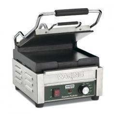 Warings Panini Sandwich Grill the Tostato Perfetto WFG150 is a compact electric grill toaster with flat cast iron plates that produce sandwiches of warm, melty goodness with beautifully browned bread. The WFG150 Sandwich Grill has a 9-1/4 x 9-3/4 cooking surface. The top plate is hinged and is lifted up and down with a heat-resistant handle. The Panini Grill accommodates foods up to three inches thick thanks to the auto-balancing upper plate, so you can grill up sandwiches stuffed with fillings. This Sandwich Grill is designed to handle heavy commercial use and features a durable brushed stainless steel body and removable drip tray for easy clean up.