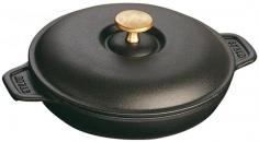 The Staub Round Plate combines the convenience of serving your signature recipe in the same pot it was cooked in. The plate's cast iron construction not only distributes heat evenly during cooking, but retains heat to keep food warm at the table.
