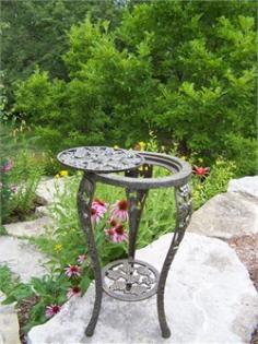 Oakland Living - Plant Stands and Potting Benches - 5027AB - About This Product: Our plant table stands are the perfect edition to any setting. Adds beauty and style both indoors and out. Constructed of durable cast iron. Features a hardened powder coat finish for years of beauty. About the Oakland Vineyards Collection: The Oakland vineyard collection is perfect for fruit and wine lovers alike. Each piece is adorned with twisty grape vines and ripe clusters of grapes. The attractive grape vines will add beauty and style to any outdoor patio garden setting. Each piece is hand cast and finished for the highest quality possible. Hardened powder coat finish in antique bronze for years of beauty Easy to follow assembly instructions and product care information Stainless steel, galvanized or brass assembly hardware Fade, chip and crack resistant Some assembly required1 Year limited manufacturers warranty Construction material: cast iron Specifications: Overall product dimensions: 26 H x 14 W x 14 DOverall product weight: 27 lbs.