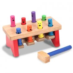 The pegs on the bench go up and down, playing peekaboo on this solid wood pounding activity. Non-removable pegs take turns showing their smiles while your toddler has fun naming the colors and enjoys practicing fine motor skills. A sturdy mallet is included.