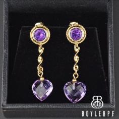 Beautiful and elegant vintage 14K yellow gold natural amethyst dangle earrings. Each earring has a heart-shaped faceted amethyst dangling from a twisted gold bar with all suspended from an amethyst stud at the top. Perfect for the February birthday girl or if purple is your go-to color.
https://boylerpf.com/
