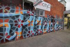 Hume City Council contacted me to create a mural at one of the entrances of Olsen Place shopping strip. It’s a small set of shops located in the northern suburbs of Melbourne. The pattern throughout the lettering is related to the theme requested by the council. The project took a couple days and everyone in the area was happy that a boring grey wall now has some colour added to it.