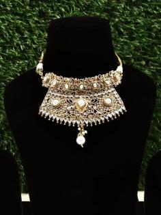 Choker Necklace with pearl Drop

Indian traditional jewellery styles are so diverse that for the bride-to-be choosing the right ornament for her special days can be both- exciting and stressful. Let 

us narrow down your search, with this stunning Kundan choker necklace, perfect to pair with your gorgeous lehenga or any other ethnic wear. The design of this necklace 

is purely Indian, with finely crafted glasswork studded in a golden metal frame. The centre of attraction in this choker is the pearls, especially the neat pearl drop 

in the centre that is adding to the beauty of this neckpiece, much like how this Kundan choker will add to your loveliness.

Choker Necklace: https://www.exoticindiaart.com/product/jewelry/choker-necklace-with-pearl-drop-lda869/	

Pearl Necklace: https://www.exoticindiaart.com/jewelry/necklaces/pearl/

Designer Necklaces: https://www.exoticindiaart.com/jewelry/necklaces/

#indianjewelry #jewelry #ethnicwear #fashion #necklace #designernecklace #chokernecklace #pearldropnecklace #traditionaljewelry #weddingjewelry #womensfashion #kundannecklace #jewellery #indianjewellery