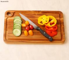 Our wooden chopping boards are crafted from high-quality wood, ensuring durability and longevity. They are designed to withstand the demands of everyday kitchen tasks while adding a touch of elegance to your countertop. The chopping boards come in various sizes, allowing you to choose the perfect one to suit your needs. Whether you need a compact cutting board for quick vegetable prep or a larger board for handling bigger tasks, we have got you covered. With the inclusion of a knife, our chopping board set provides convenience and practicality. The knife is specially designed to complement the chopping board, ensuring precise and effortless cutting.