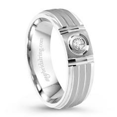 This mens round diamond wedding band elegantly crafted in 14k white gold and with a total diamond weight of 0.10 ct. Also available in 14k yellow gold