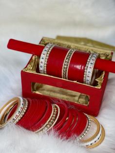 As brides embark on their journey towards matrimony, the choora serves as a tangible manifestation of their commitment and devotion to their partner. 
Crafted with meticulous attention to detail, these ornate bangles not only adorn the bride's wrists but also carry profound symbolic significance, making them an integral part of bridal attire.