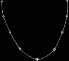 Introducing the Isa Necklace, a timeless and versatile everyday classic that effortlessly adds a touch of understated elegance to your daily attire. This necklace boasts a simplistic and delicate design, showcasing 11 round, sparkly simulated diamonds that are securely captured in a bezel setting, adorning a graceful and slender silver chain.