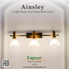 Light up your home with the stunning Ainsley 3 Light Brass and Glass Wall Lamp! Designed to perfection, this fixture brings a touch of luxury and warmth to any space. It will enhance your living room ambience or brighten up your hallway.