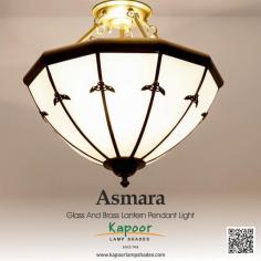 Asmara Glass and Brass Lantern Pendant Light is a fusion of sophistication and warmth, perfect for any setting. Crafted with exquisite detail, this pendant light adds a touch of class to your home decor. Let its soft glow elevate your ambience and create an inviting atmosphere.