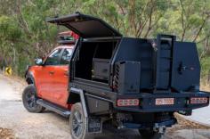 At Trojan Camping & 4x4, we have experienced tradespeople in Adelaide ready to create a custom canopy for your vehicle. We have installers across Australia who can help you wherever you are. Our canopies include various internal accessories like a Bushman 851 upright fridge and mounting cage, central locking wired to your vehicle, and a modular drop-in drawer with a slide-out bench. 