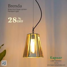 Add a touch of elegance and sophistication to any room with our stunning Brenda Brass and Glass Lantern Pendant Light. Perfect for both modern and classic interiors. Made with premium materials for lasting beauty and durability. It creates a cozy and inviting atmosphere with its soft, ambient glow. 