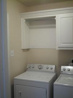 this is a great laundry room makeover with space to hang dry or put freshly ironed shirts