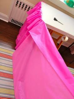Fold over the table cloth and tape it for a double ruffle look.