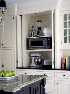 Appliance "garage." helps keep your countertops cleared off. Only take them out when you need them...so smart.