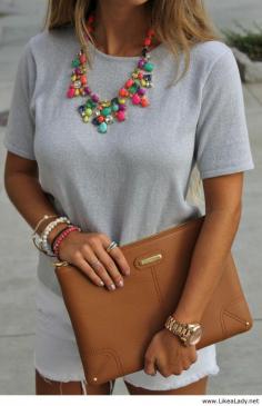 Neutrals with bright colored statement necklace and beautiful clutch