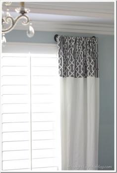 great idea for curtains w/out having to spend a fortune- panel your nice fabric on top of a basic drape.