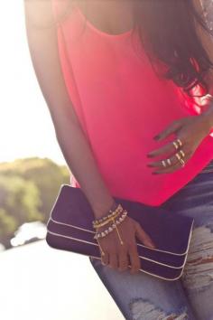 Her jeans, clutch, rings and top. Love.