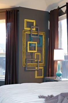 cool way to fill a weird wall -- I might do this and paint the frames the same colors as my two accent walls to tie everything together!