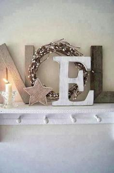 NOEL letters made from rustic wood plus a simple wreath. Love this presentation.