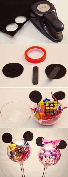 TOO CUTE!  The BEST idea for party favors!  Fill clear plastic balls with goodies & top with construction paper ears...looks like Mickey