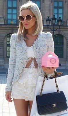 Tweed jacket worn over lace top & shorts, perfectly accessorized w/ Chanel bag