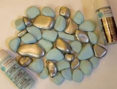 painted rocks - why did I never think of this? Rocks from the dollar tree painted to match any decor. Put them in a glass container with a candle.