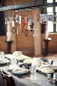What a cute idea, at your engagement party, hang special pictures of your life with your significant other to-be for your guests to see above the table