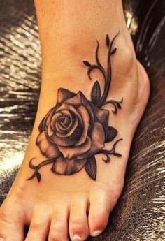 Women tattoos: Rose tattoo on foot