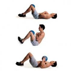 Grab a medicine ball for an intensified crunch workout that will flatten your belly in seconds flat