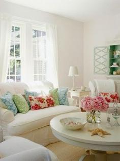 I like the idea of a fluffy white bed with accent pieces