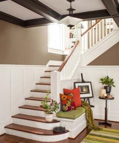 foyer of remodeled Craftsman with stairway, wainscoting and box-beam ceiling, oak floors