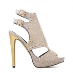 embellished by gleaming metallic studs
