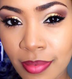 gold to maroon on eyes with heavy black liner and lashes. pink lips with darker lip liner.