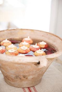 floating apples with tea candles for fall weddings