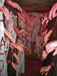 Hallway of Hands.  Hoping a few strategic ones are real..~.Did this idea in the 80s at a school haunted house fundraiser. Couldn't get any more kids to walk through it after the first couple victims were grabbed & terrorized. No one else would enter the 'Hall of Hands' .