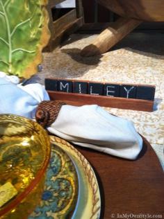 Great idea!!! Paint square (scrabble size) tiles with blackboard paint! Pottery Barn Place card and holder idea