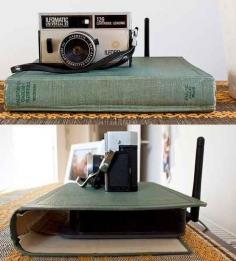 Use a hollowed out book to hide an unsightly router.