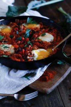 Shakshouka - a stewed tomato and vegetable sauce with poached eggs, #harissa, kale, and mushrooms!   #brunch #labordayweekend #Tunisian #vegetarian