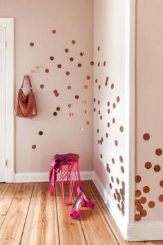 Cut out some dots from shiny paper and you've got some great wall design. Image via Bloesem